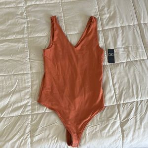 Orange Abercrombie body suit